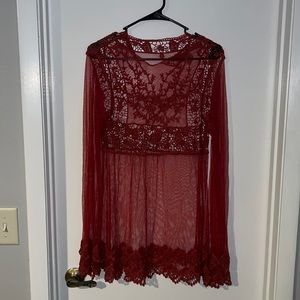 Sheer long sleeve mid thigh dress. Rust orange. US size medium